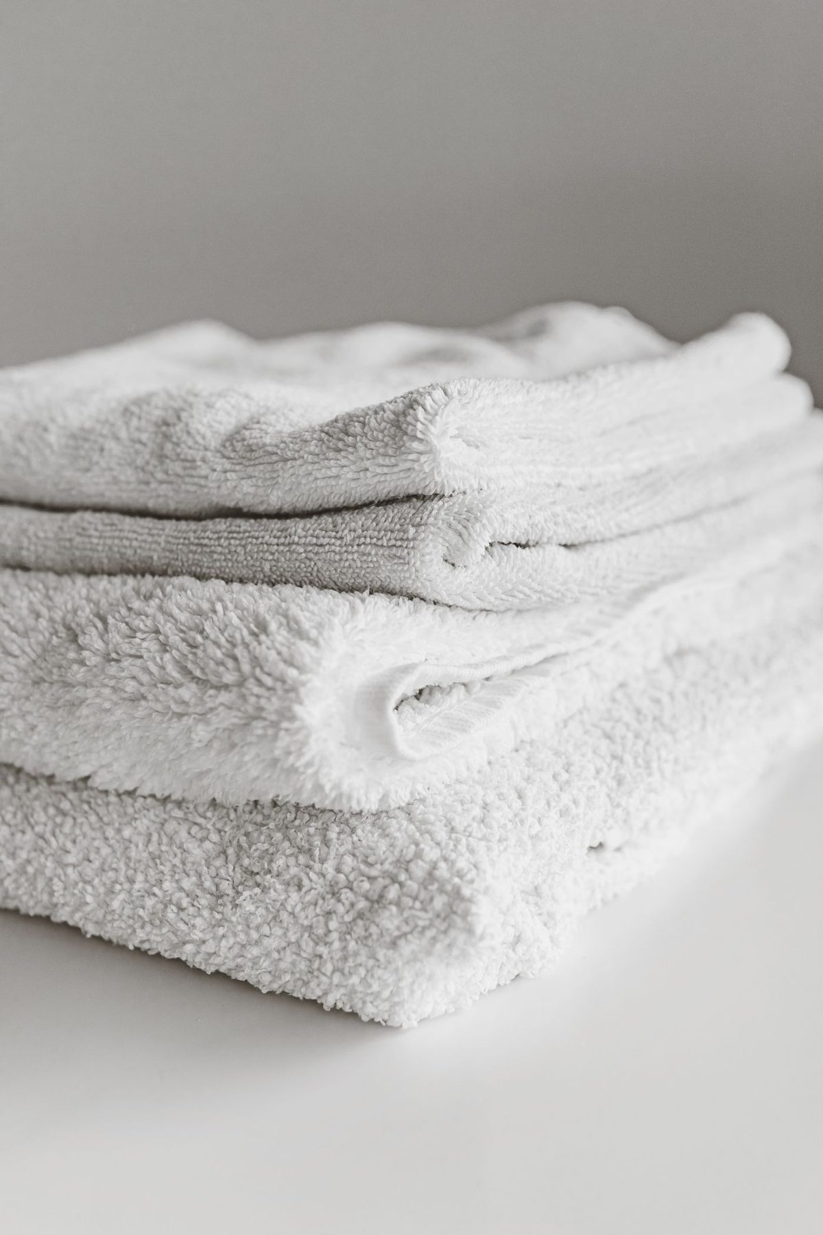 Folded stack of white bath towels